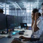 Confused person looking at cybersecurity terms on screen