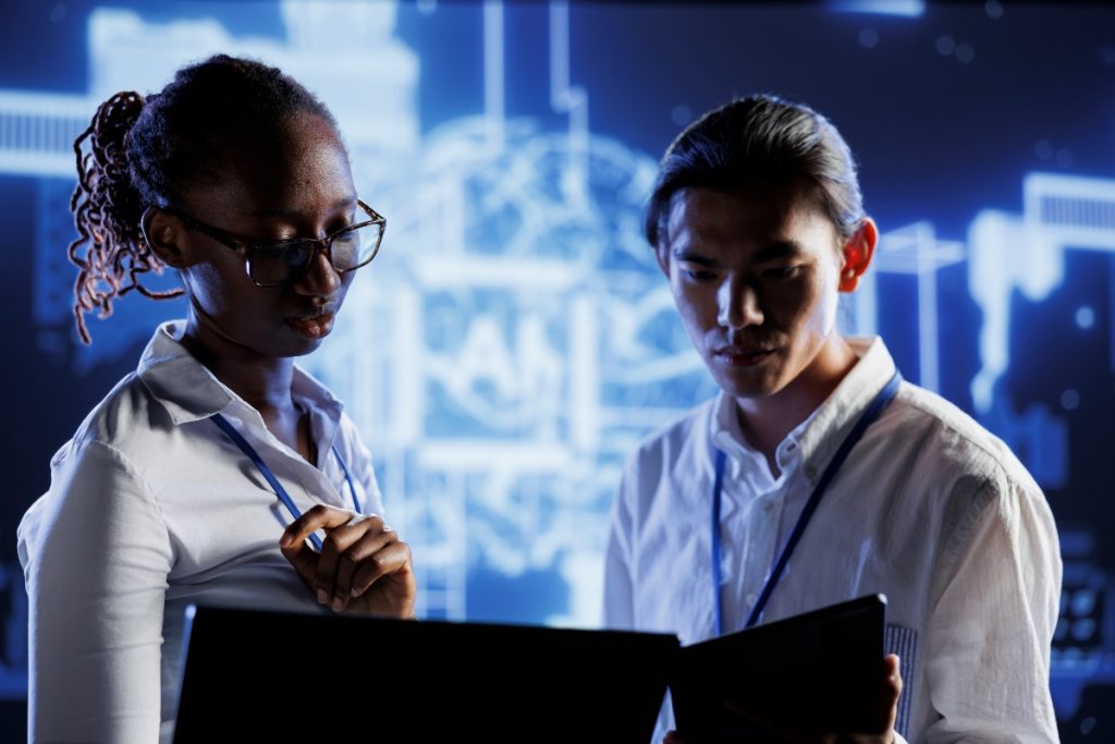 Analyst reviewing cyber threat data charts